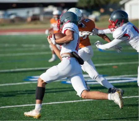 football player running with the ball